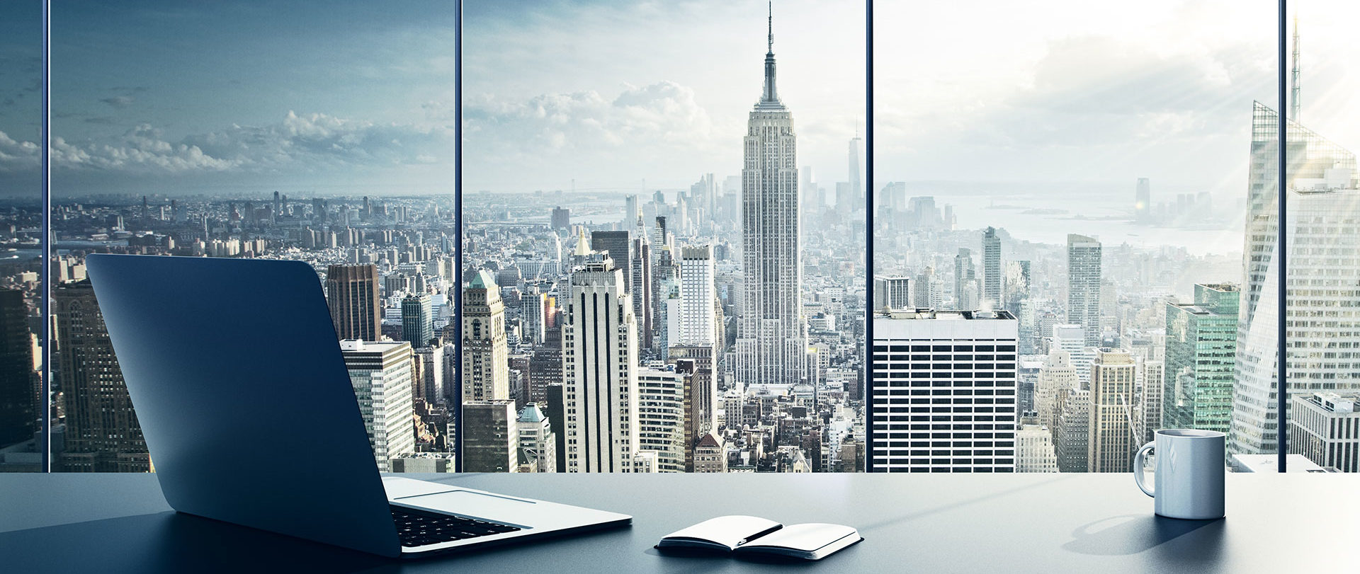 City skyline viewed through the windows of a modern office